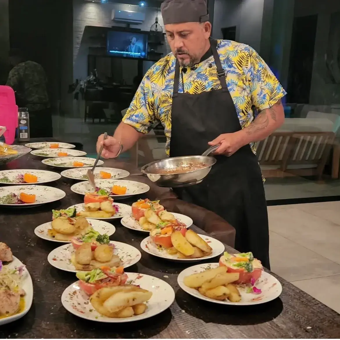 Private chef preparing a candlelit dinner for two in a Costa Rica villa