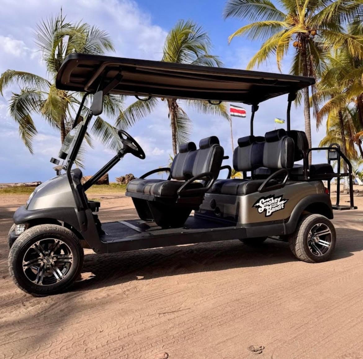 Lifted gray 6-passenger golf cart with beach buggy styling in Costa Rica