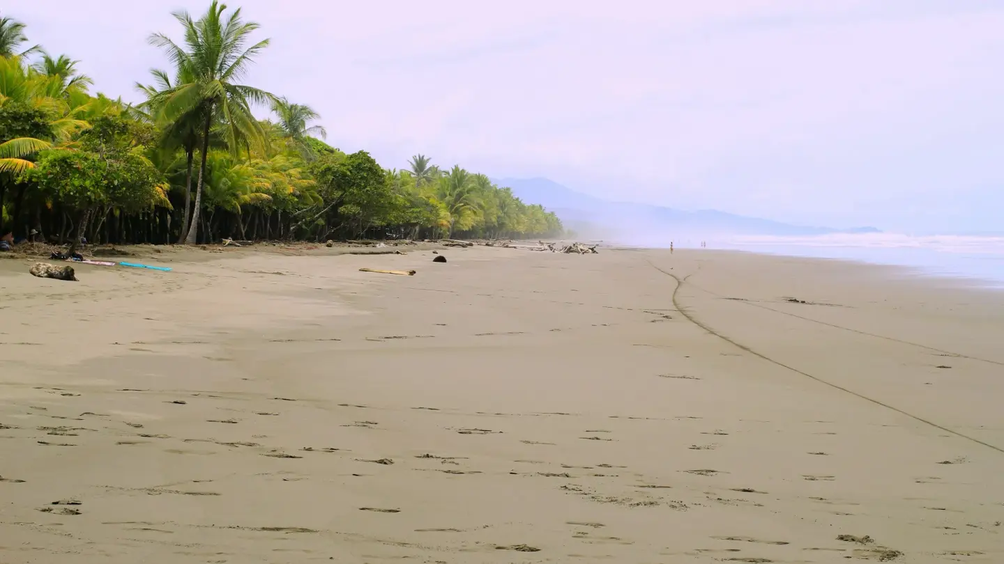Jaco Romantic Getaways - couple on a Costa Rica romantic getaway sunset walk on Jaco Beach
